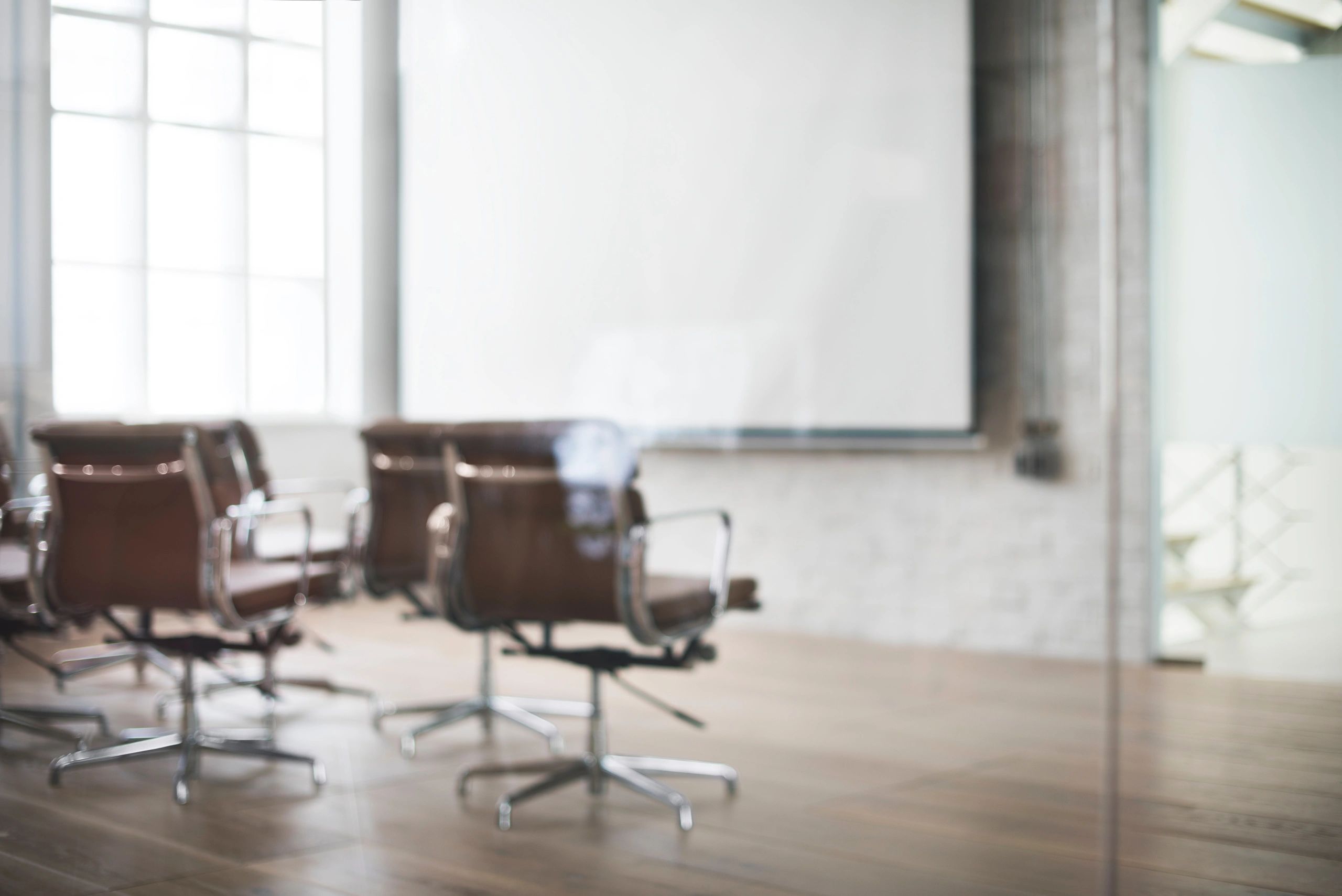 Hotel conference room with seating and presentation whiteboard